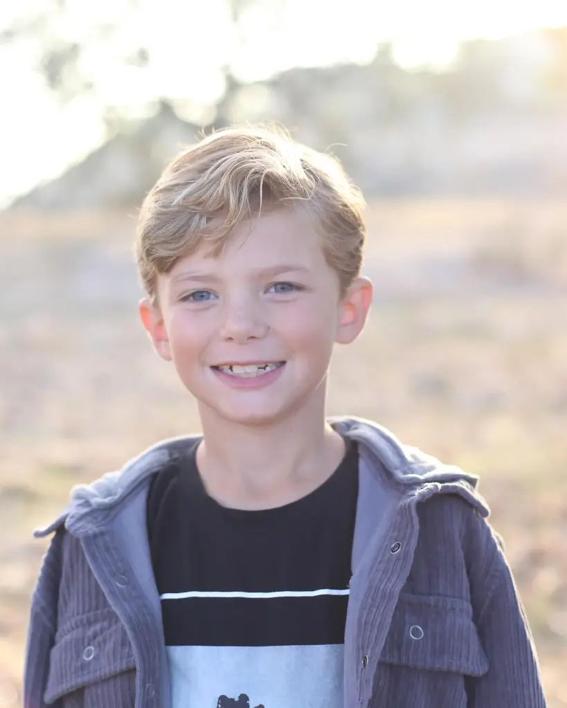Reis Beck, a 13-year-old boy, smiling.