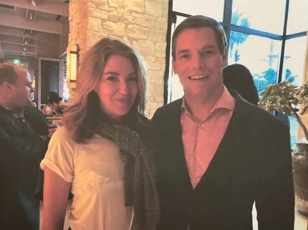 Lonna Drewes and Eric Swalwell smiling at an event.