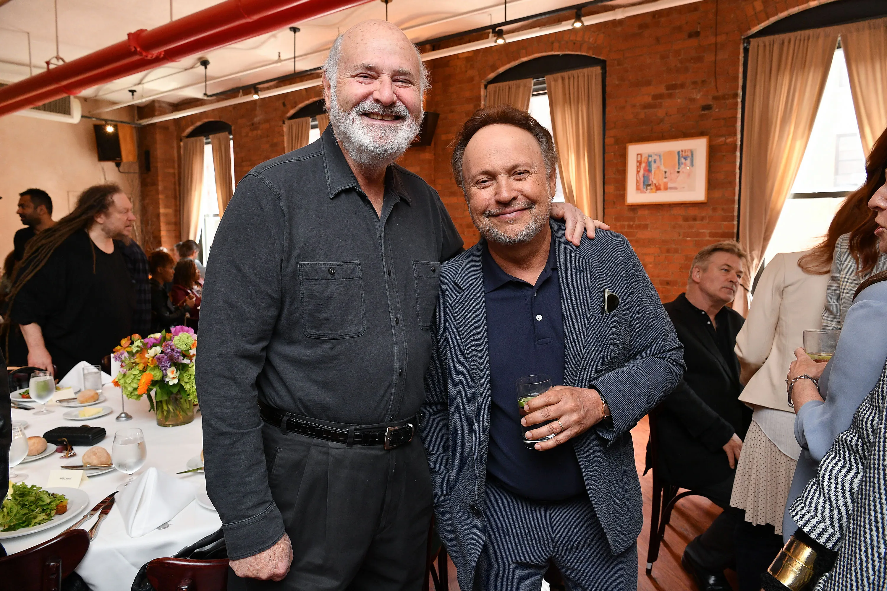 Rob Reiner and Billy Crystal posing together at a Tribeca Film Festival event.