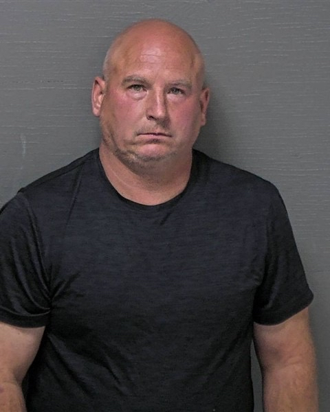 Robert "Bob" McCaffrey Jr., who is charged in the 1990 killing of Lisa Marie McBride, appears in a booking photo after his arrest.