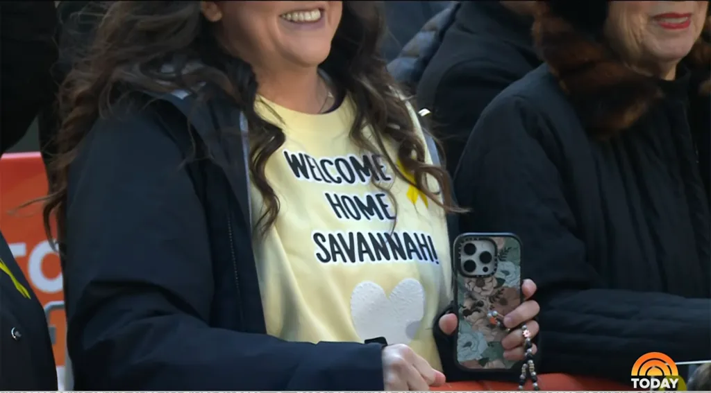 A fan wearing a "Welcome Home Savannah!" shirt at the TODAY show.