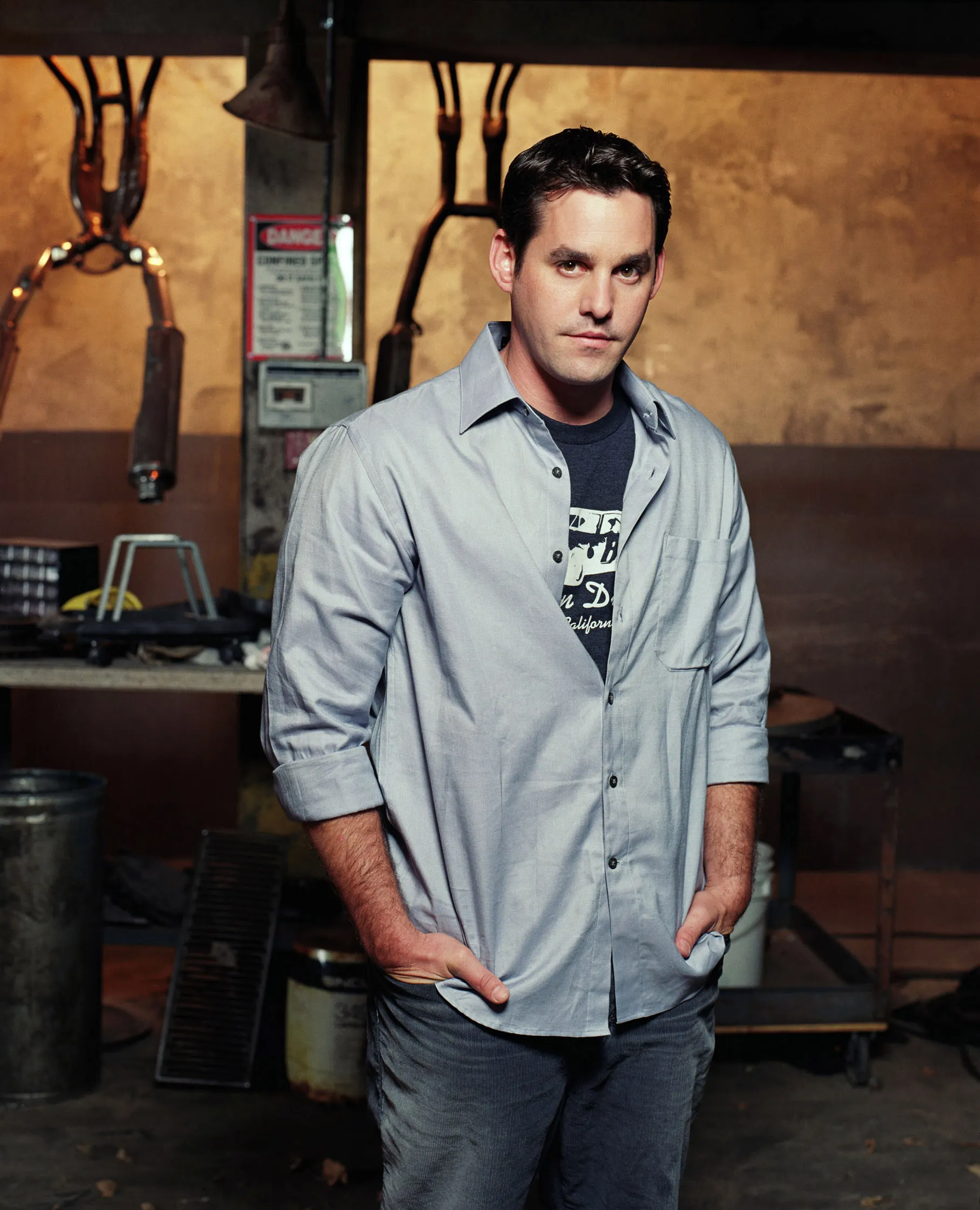 Nicholas Brendon as Xander in "Buffy the Vampire Slayer" Season 6, standing in a laboratory with his hands in his pockets.