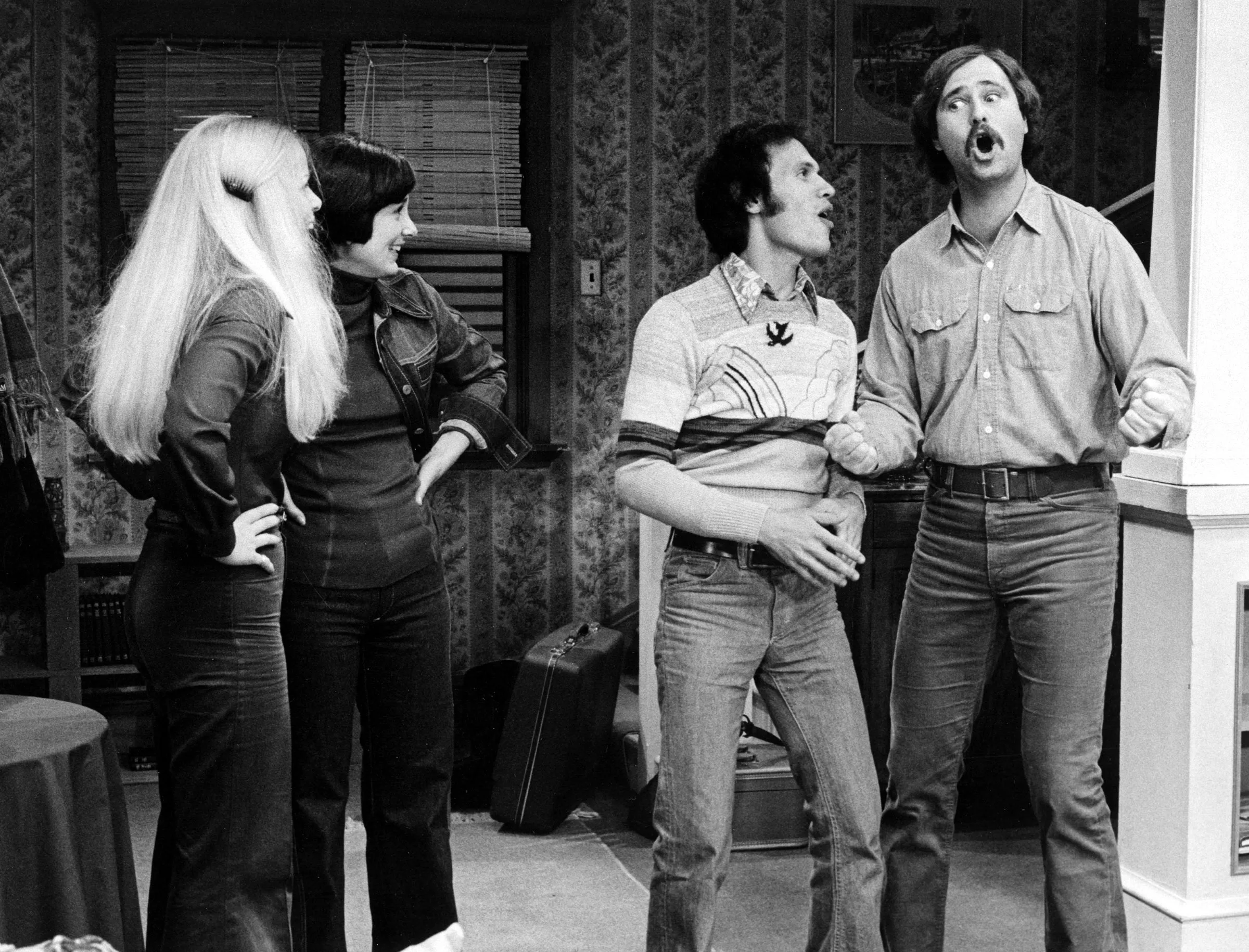Billy Crystal and Rob Reiner singing to Sally Struthers and Elaine Princi in a scene from "All in the Family".