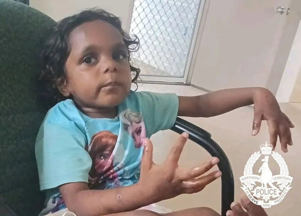 A photo of Sharon Granites, a missing five-year-old girl, with the Northern Territory Police logo in the bottom right corner.
