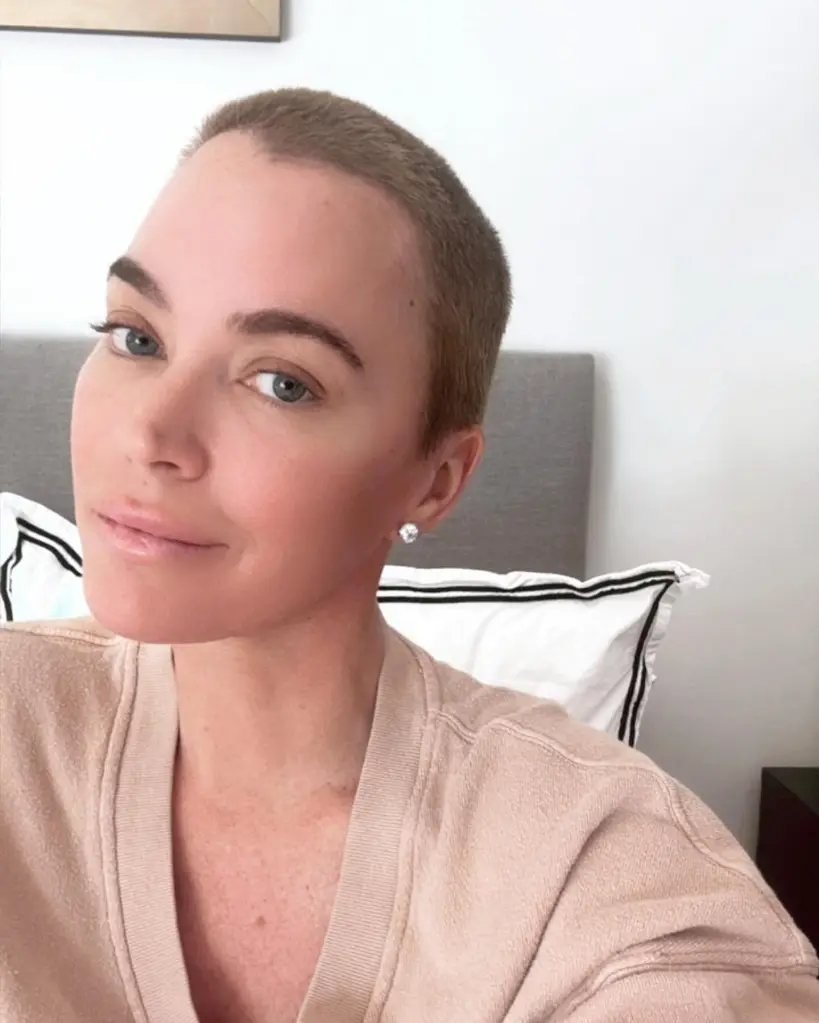 Teddi Mellencamp with a buzz cut looking directly at the camera.