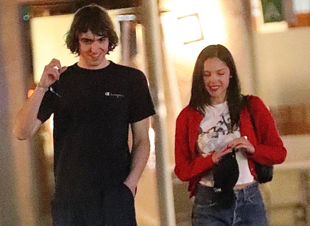 Olivia Rodrigo smiling with Cameron Winter after a dinner date in Los Angeles.
