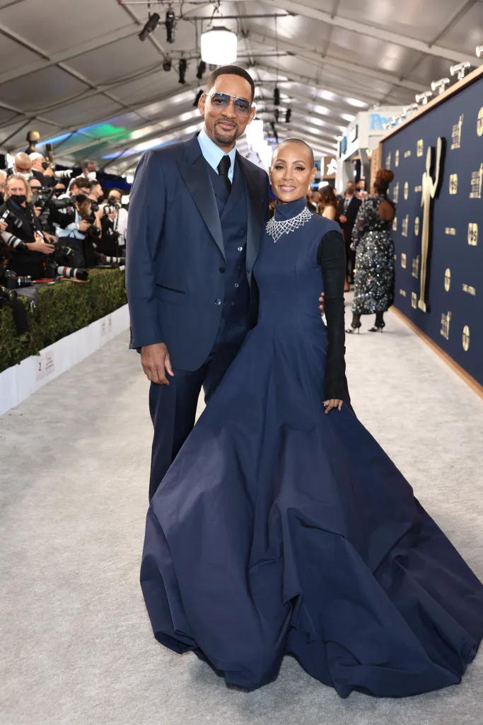 Will Smith and Jada Pinkett Smith posing on the red carpet.