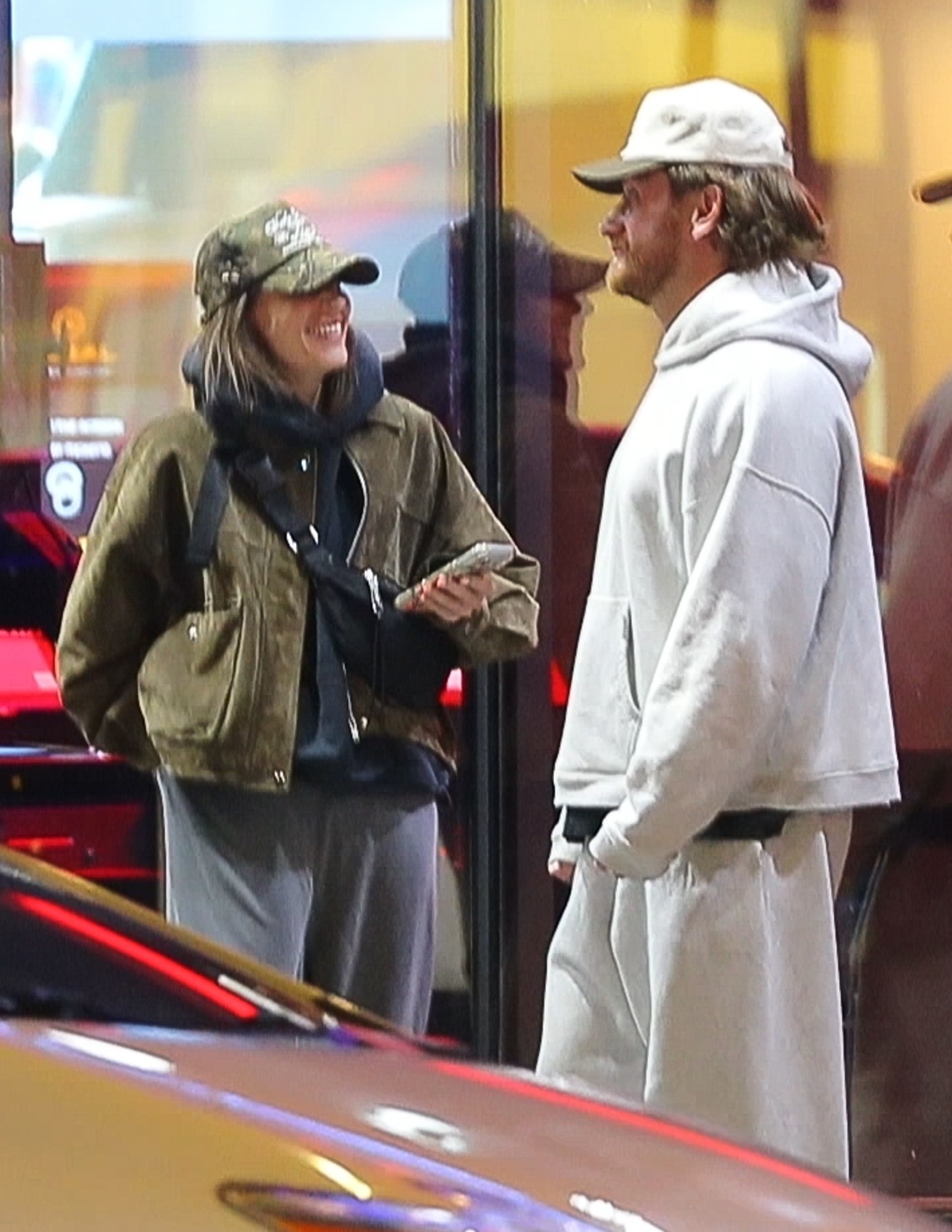 Amanda Batula and West Wilson laughing together during a night out.