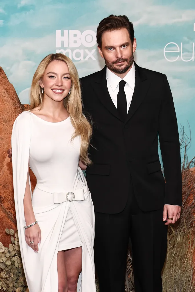 Sydney Sweeney and Sam Levinson smiling at the "Euphoria" Season 3 Premiere.
