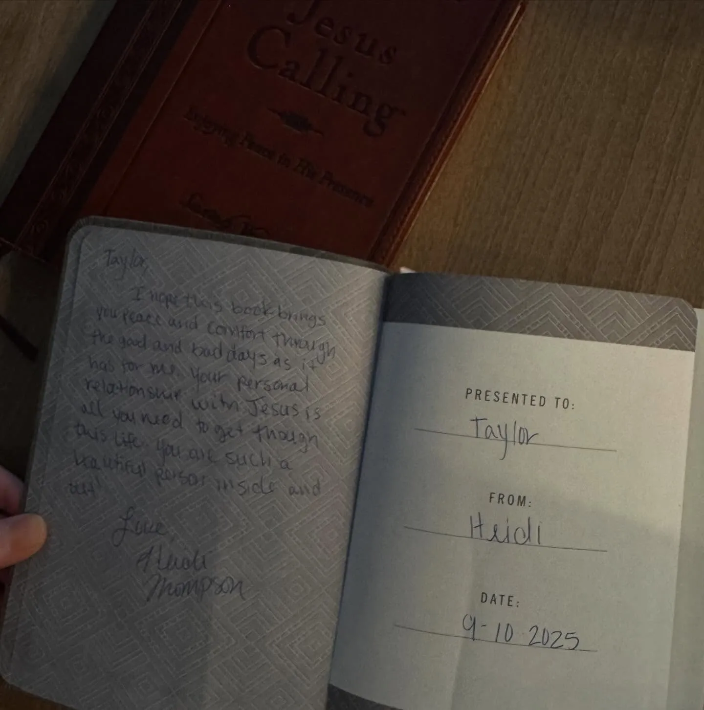 An open "Jesus Calling" book with a handwritten inscription from Heidi to Taylor dated 9-10-2025.