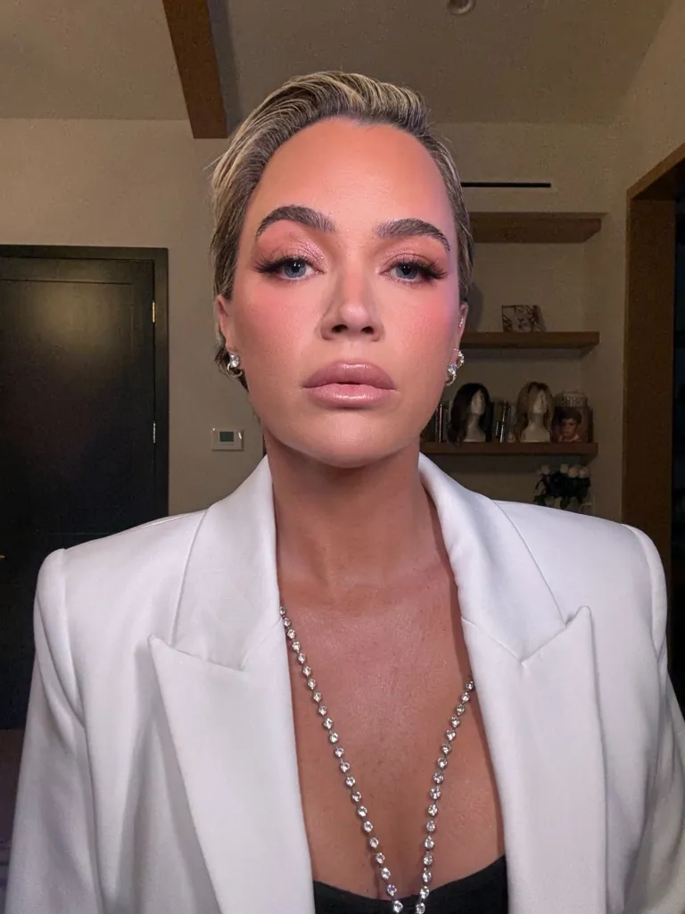 Teddi Mellencamp Arroyave wearing a white blazer and a sparkling necklace.