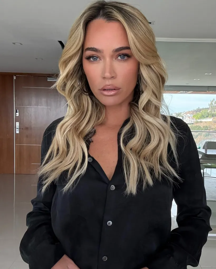 Teddi Mellencamp with wavy blonde hair, light blue eyes, and wearing a black button-down shirt.