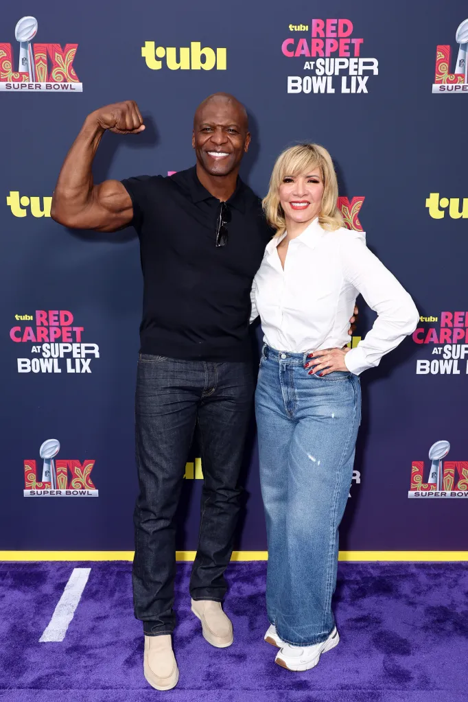 Terry Crews flexing next to Rebecca Crews on a purple carpet with "Tubi Red Carpet at Super Bowl LIX" signs.