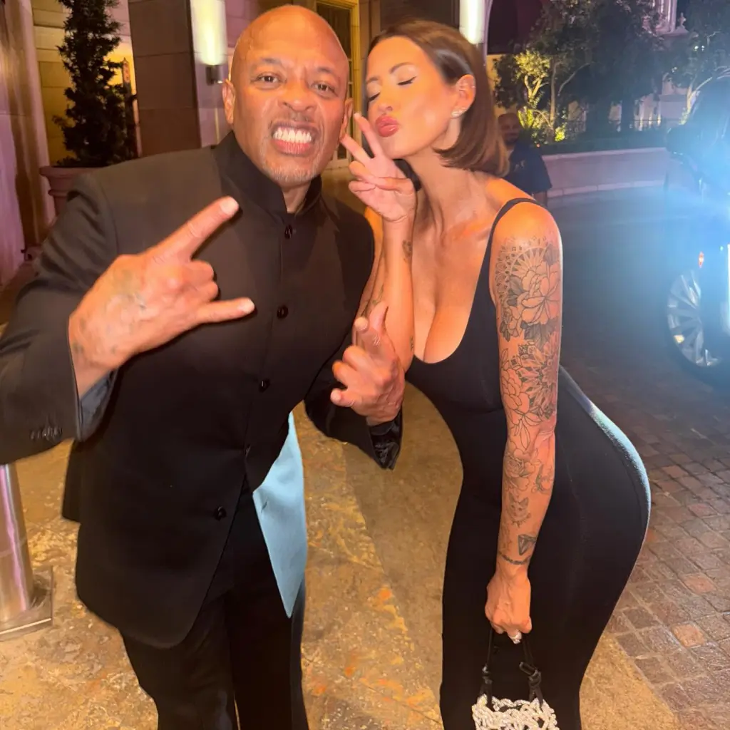 Dr. Dre and Ashley Palmer-Gilkey posing together.