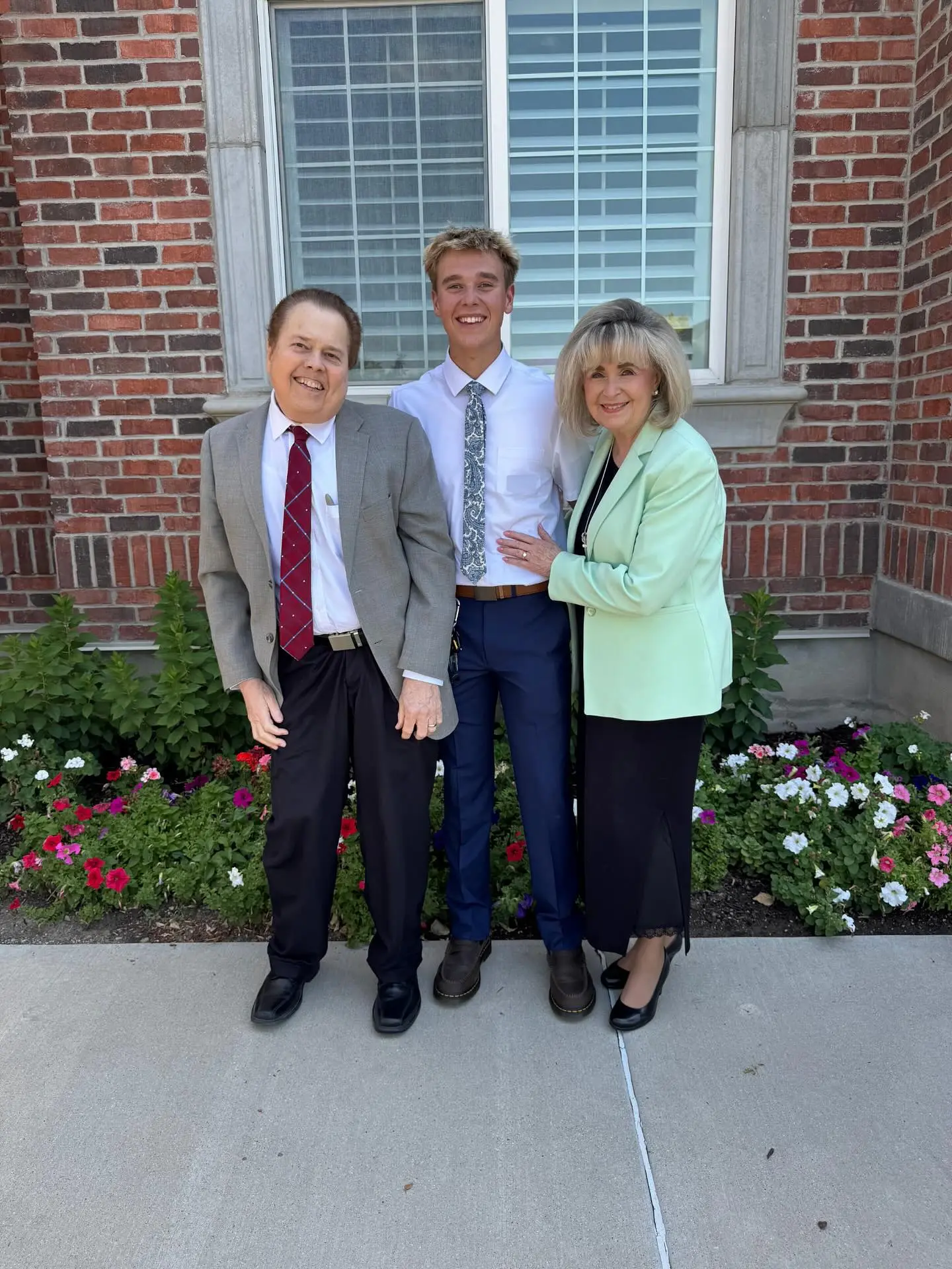 Alan Osmond with grandson Luke and wife Suzanne
