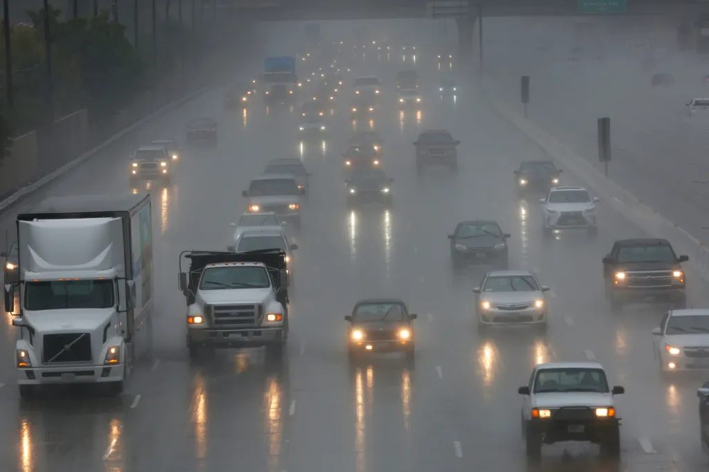 Traffic snarled on a freeway due to a big storm.