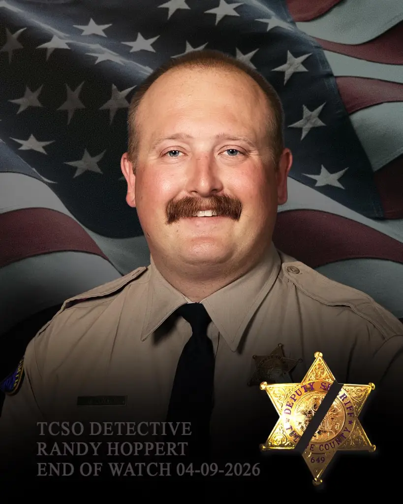 A headshot of Tulare County Sheriff Detective Randy Hoppert in uniform, with an American flag background and a sheriff's badge with a black band. Text reads: 