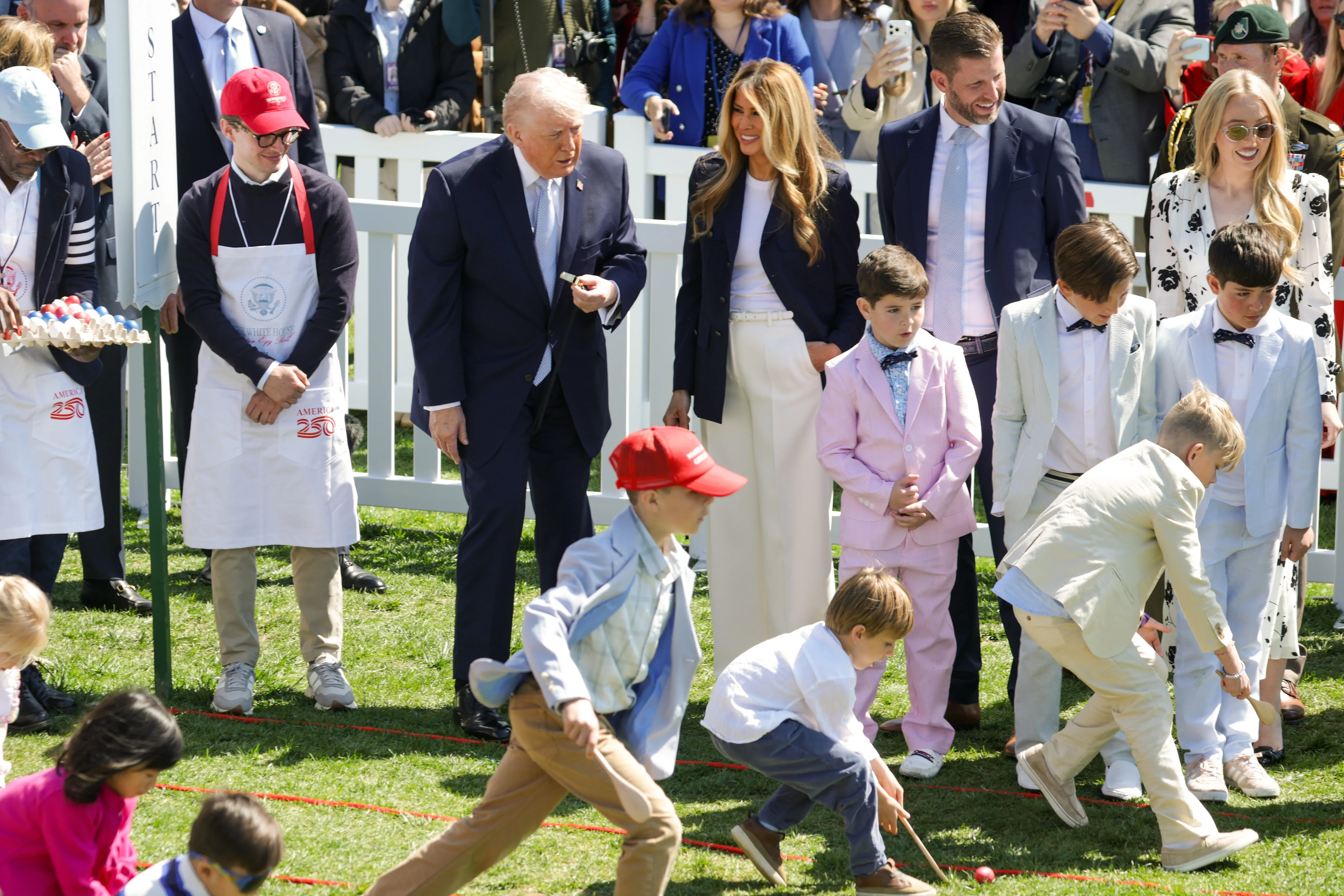 Donald Trump, Melania Trump, Eric Trump, and Tiffany Trump watching children participate in the White House Easter Egg Roll.