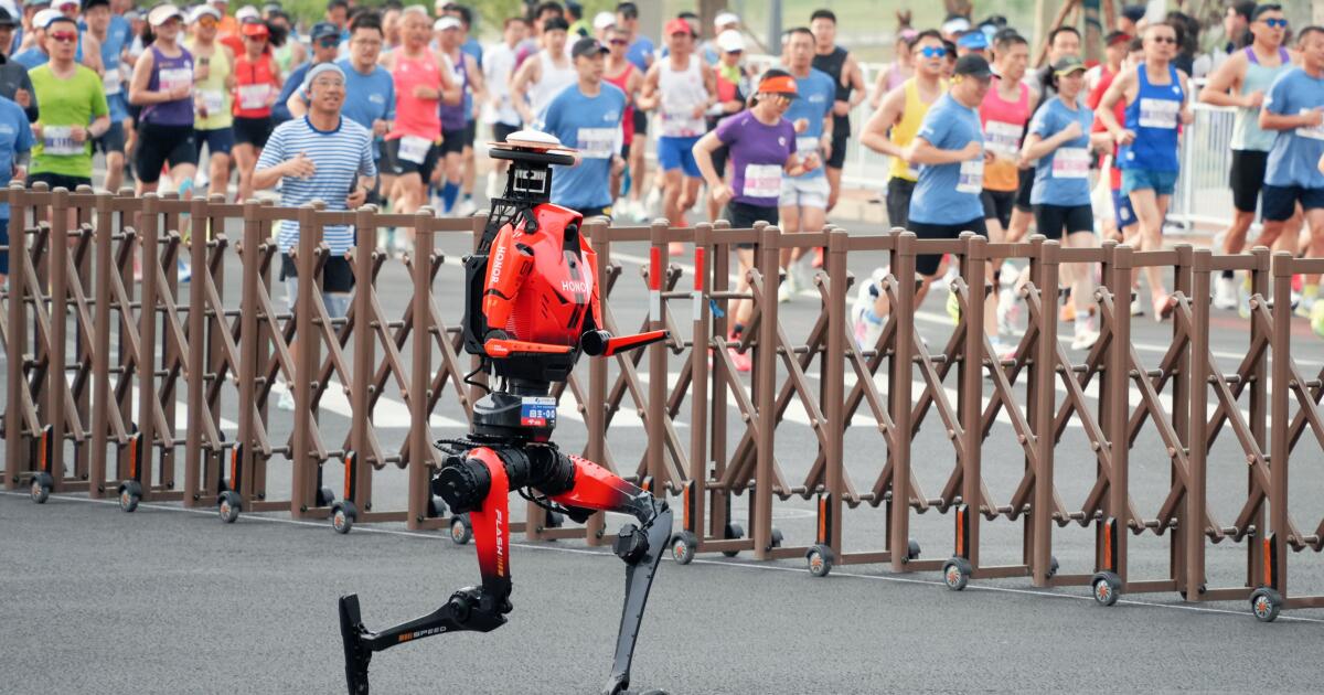 Robot named Lightning blows past human runners to set half-marathon record in Beijing