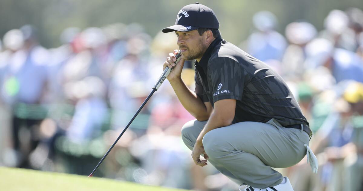 ‘Thanks to the lady on 8’: Xander Schauffele saves par after ball lands in fan’s bag at Masters
