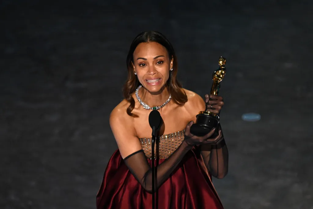 Zoe Saldana accepting the Best Actress in a Supporting Role award for "Emilia Perez" at the 97th Annual Academy Awards.
