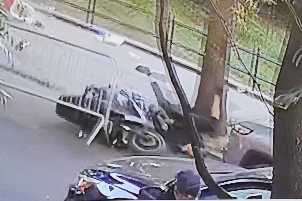 Video shot from court presentation showing a scooter and a person on the ground.
