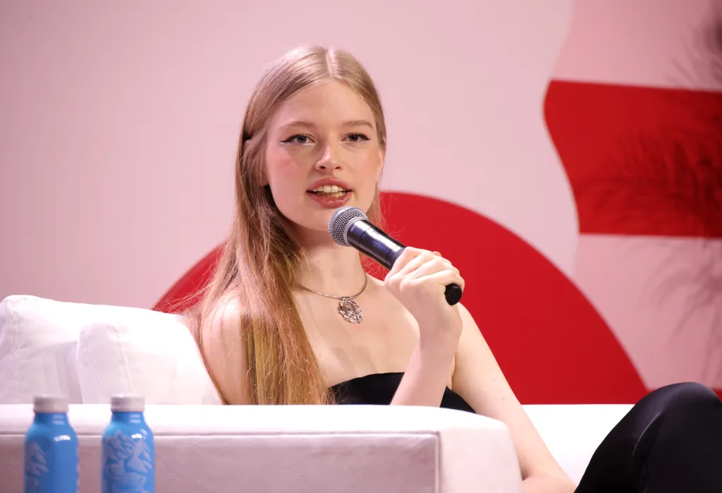 Vivian Jenna Wilson speaking into a microphone.