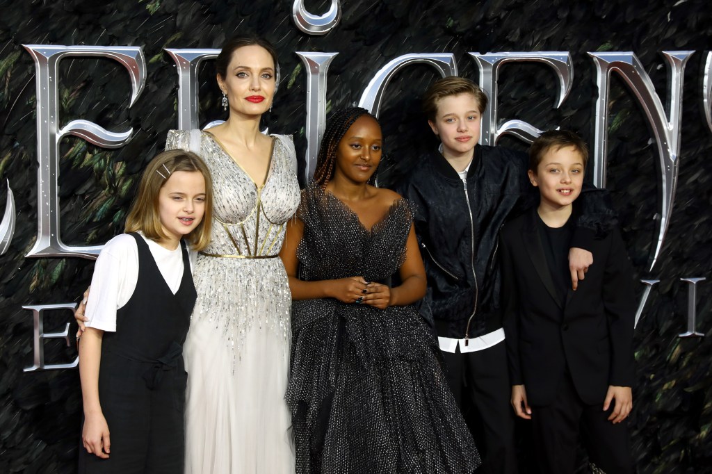 Angelina Jolie poses with her children Vivienne, Zahara, Shiloh, and Knox at the "Maleficent: Mistress Of Evil" European Premiere.