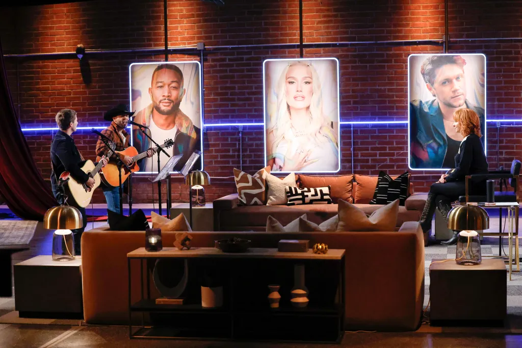 Dylan Carter, Tom Nitti, and Reba McEntire on a stage during The Voice Battles.
