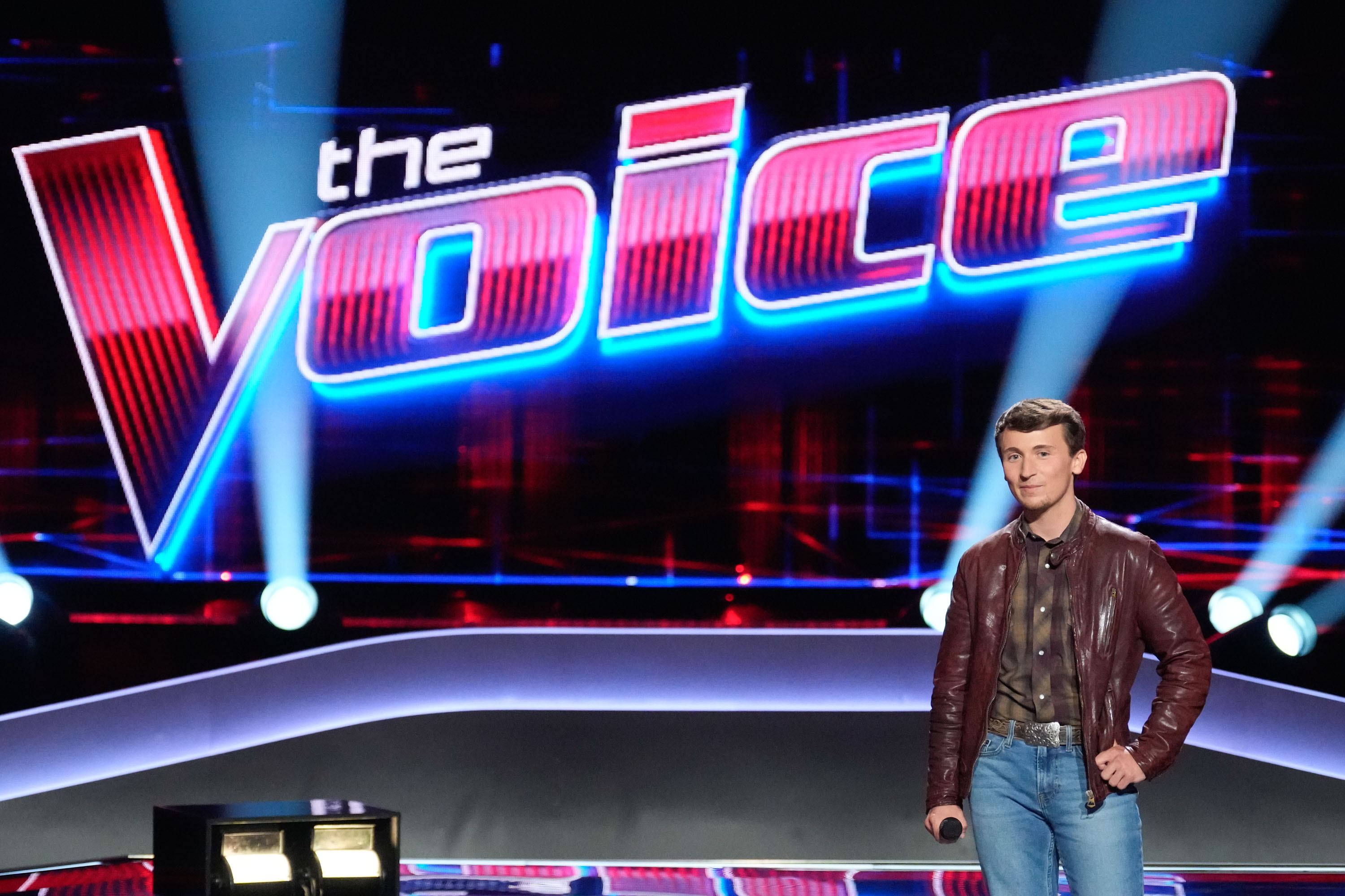 Dylan Carter standing on "The Voice" stage.