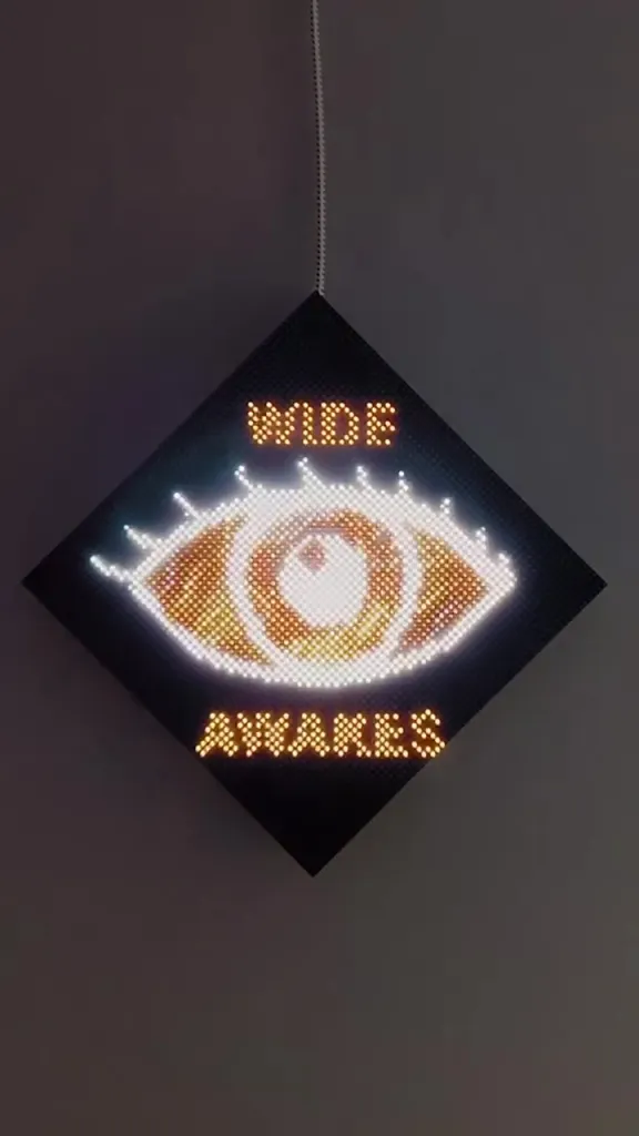 The Wide Awakes logo, a glowing eye with "WIDE" above and "AWAKES" below.