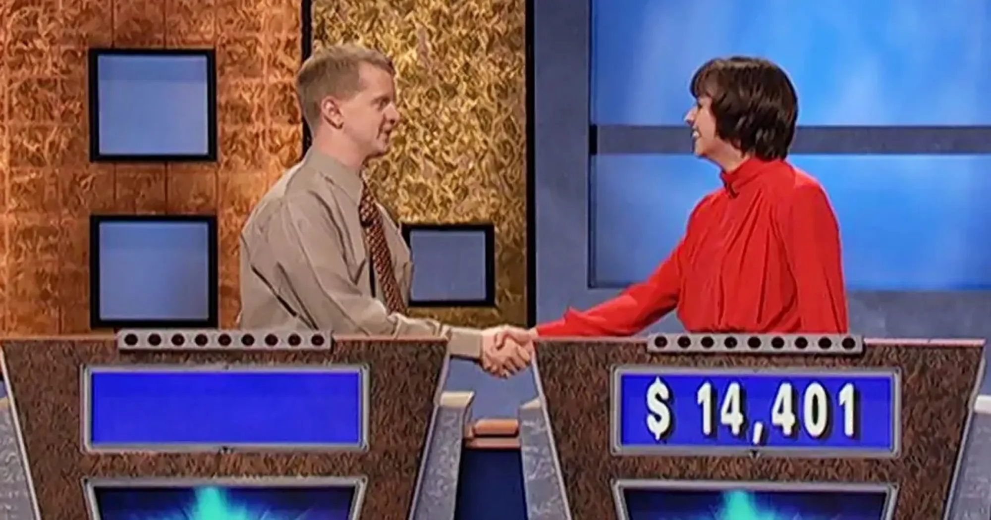 Ken Jennings shaking hands with the contestant who beat him on Jeopardy.