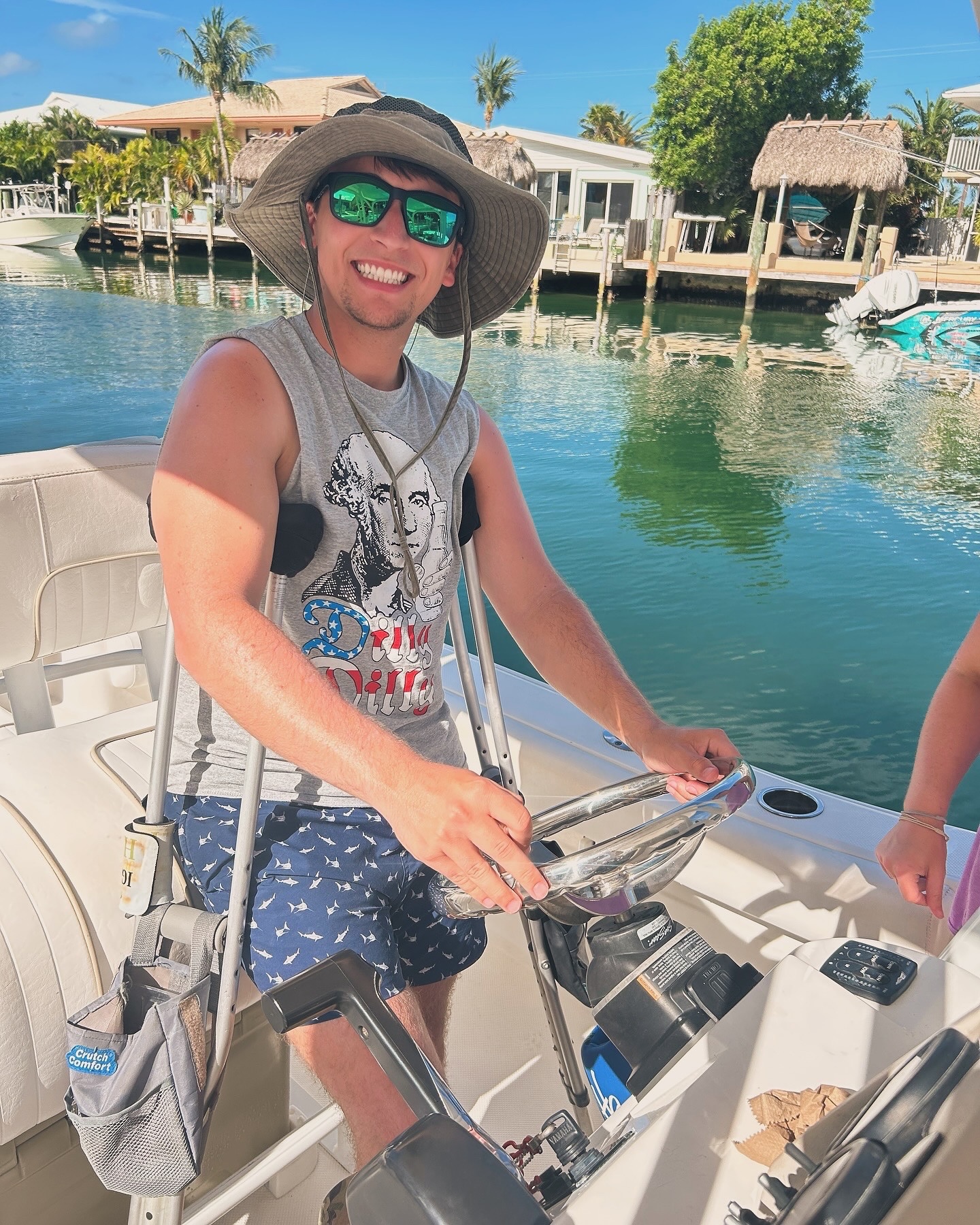 Dylan Carter smiling while driving a boat.