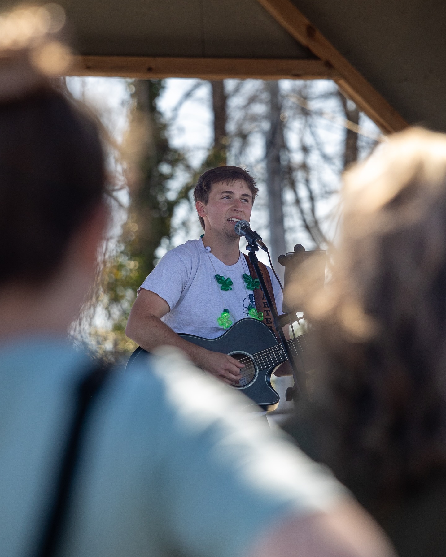 Dylan Carter performing with a guitar and microphone.