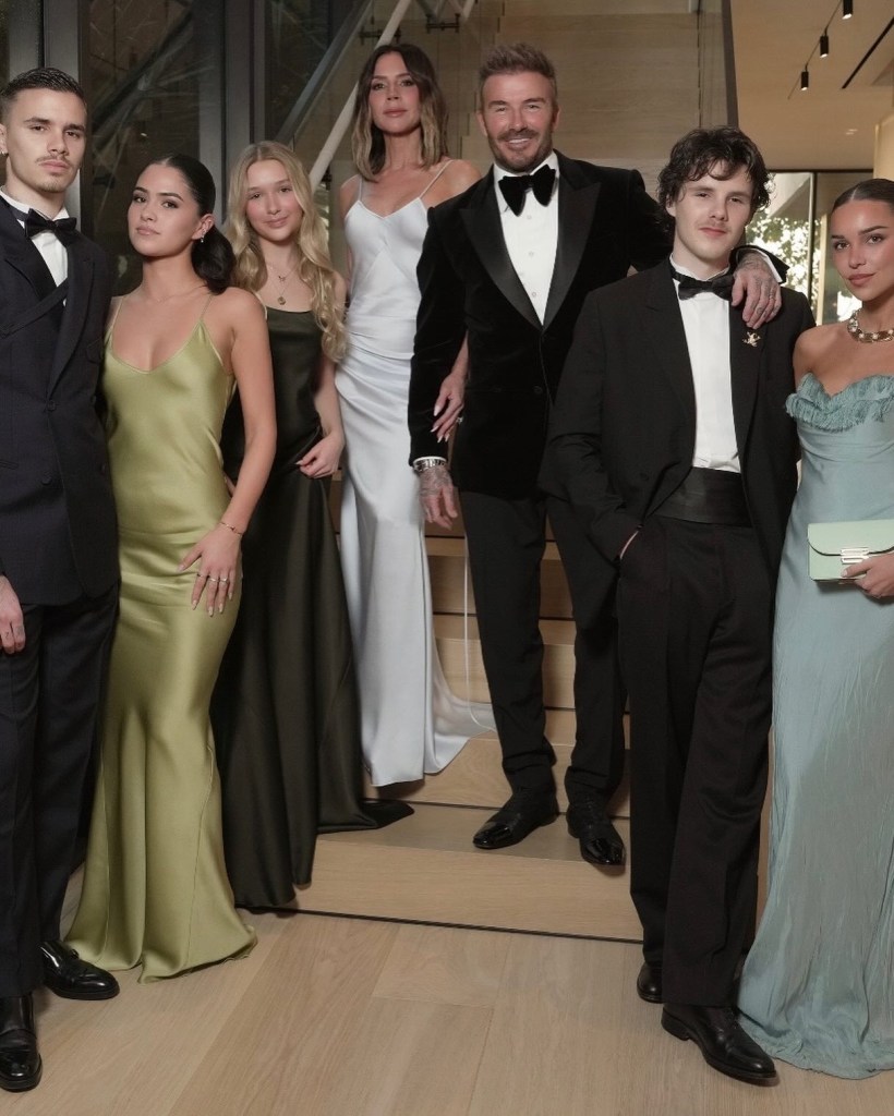From left: Romeo Beckham, in a black tuxedo, Kim Turnbull in an Olive green gown, Harper Beckham in a dark green dress, Victoria Beckham in a silver gown, David Beckham in a black tuxedo, Cruz Beckham in a black tuxedo, Jackie Apostel in a blue dress.