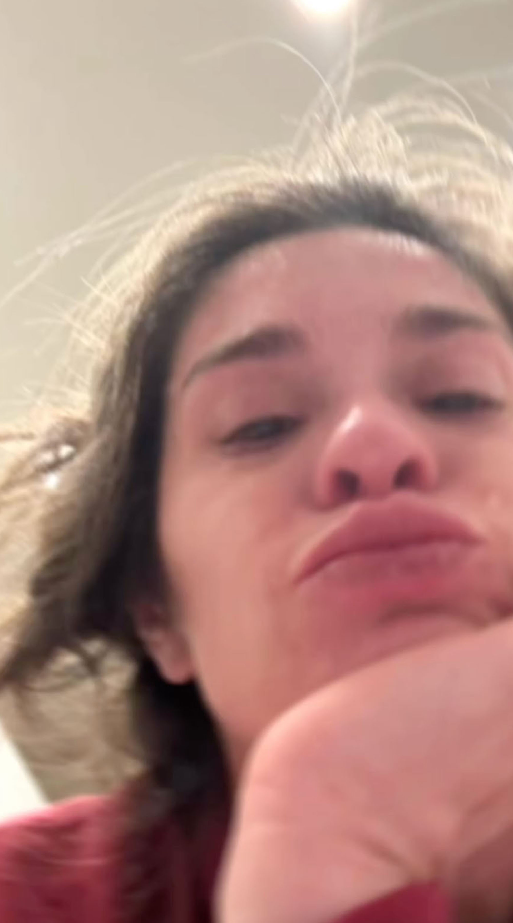 A selfie of Taylor Frankie Paul looking up at the camera with a slight pout.