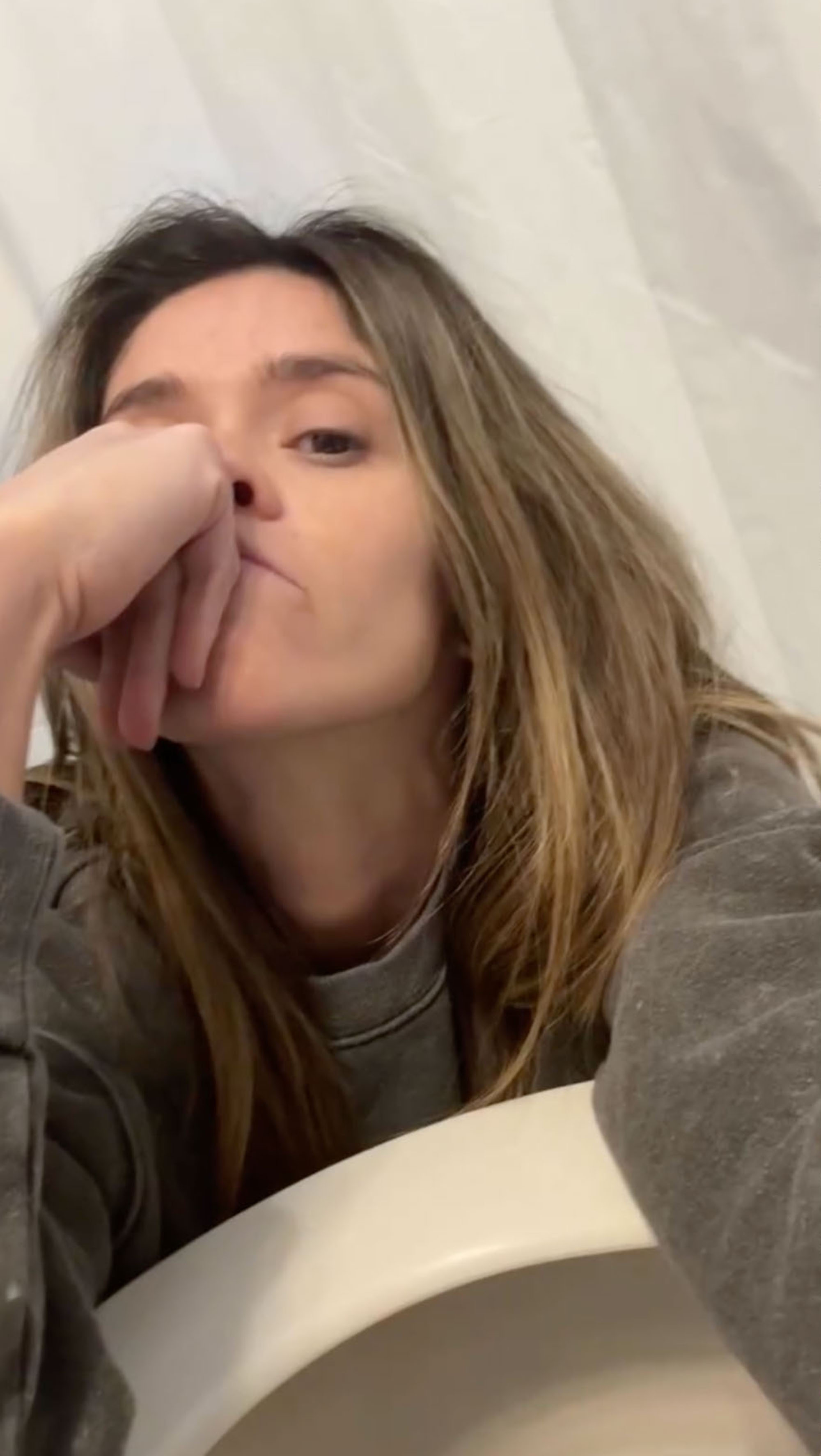 Taylor Frankie Paul with her hand covering her mouth.