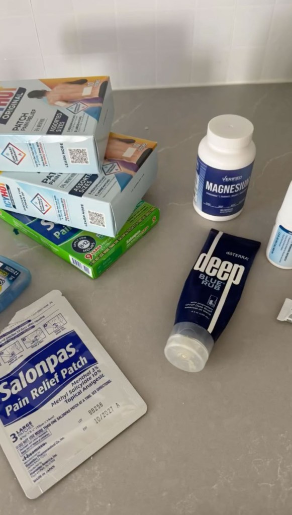 Assortment of pain relief products including patches, cream, and magnesium.