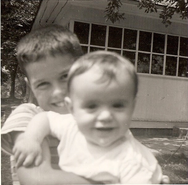 Donny Osmond holding his brother Alan as a baby.