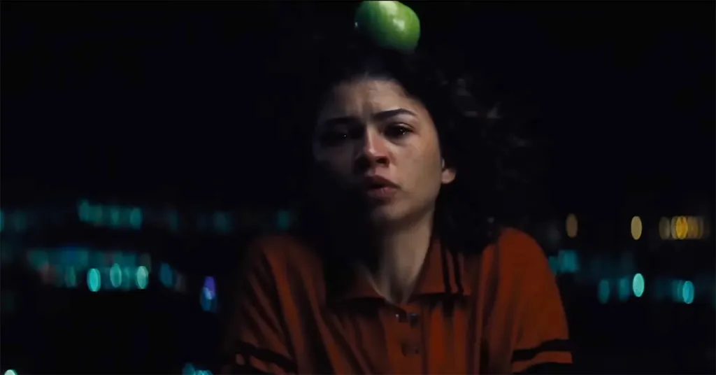 Zendaya as Rue Bennett in "Euphoria" with a green apple on her head.