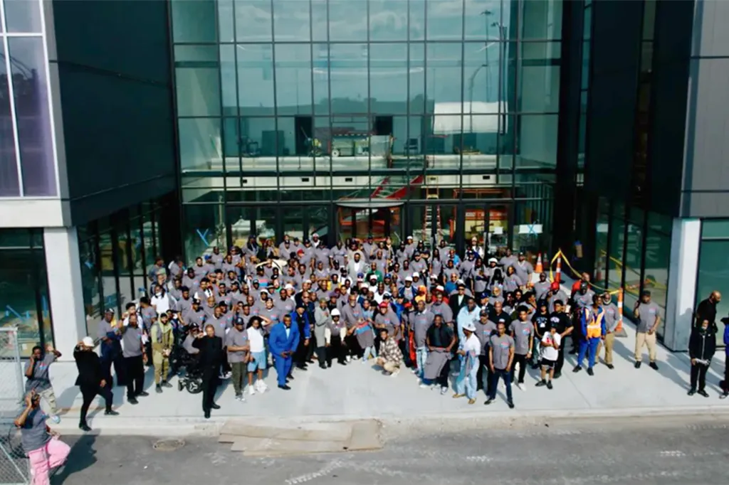 Hundreds of men gather outside the nearly completed Robert R. McCormick Leadership & Economic Opportunity Center during Pastor Corey B. Brooks’ "1000 Men Unity Gathering" on Chicago’s South Side.