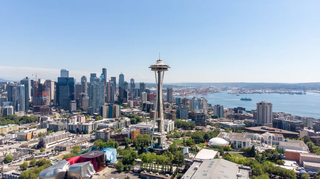 Aerial view of Seattle downtown with the Space Needle, skyscrapers, and harbor.
