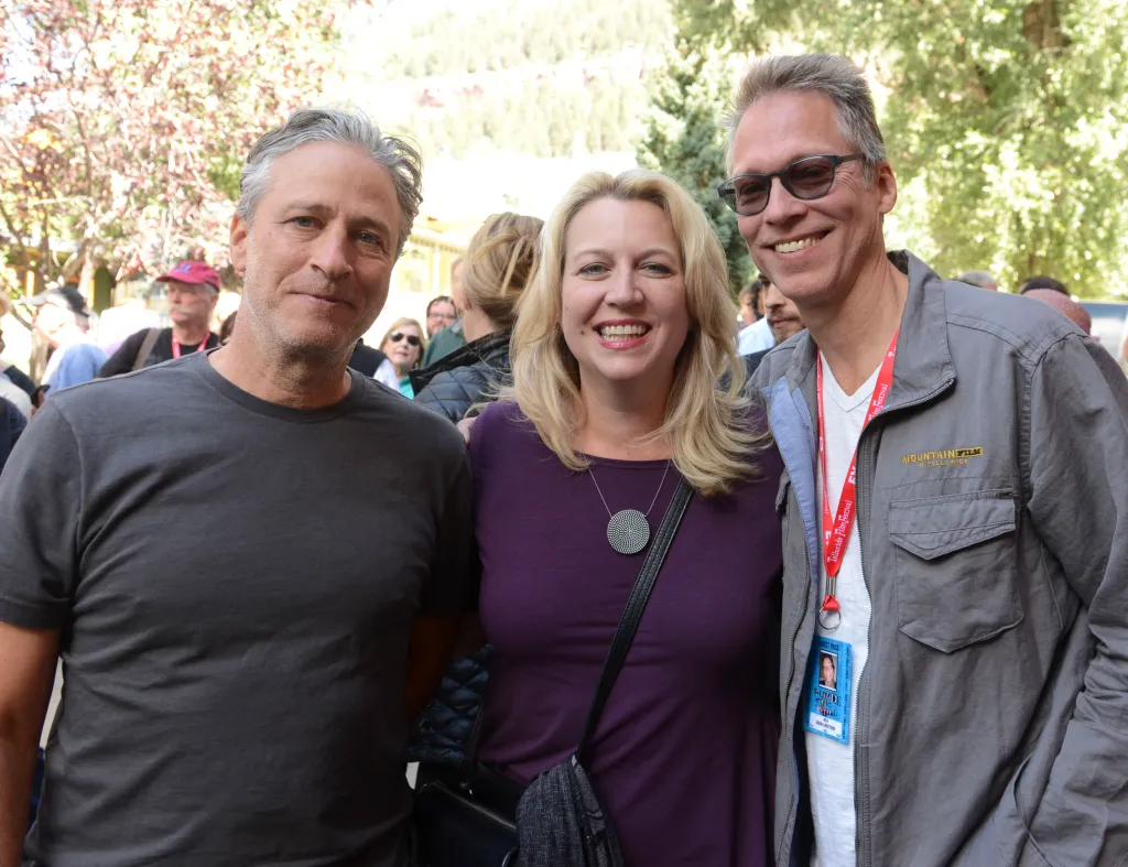 Jon Stewart, Cheryl Strayed, and Brian Lindstrom pose for a photo at the Telluride Film Festival.