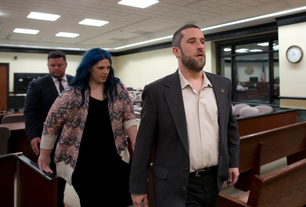 Dustin Diamond, his fiancée Amanda Schutz, and her attorney walk out of the courtroom.