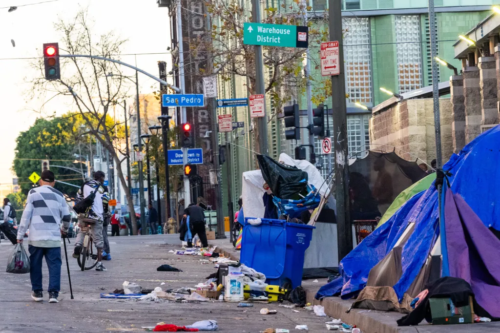 Homeless encampments, litter, and street signs in the Downtown Industrial District.
