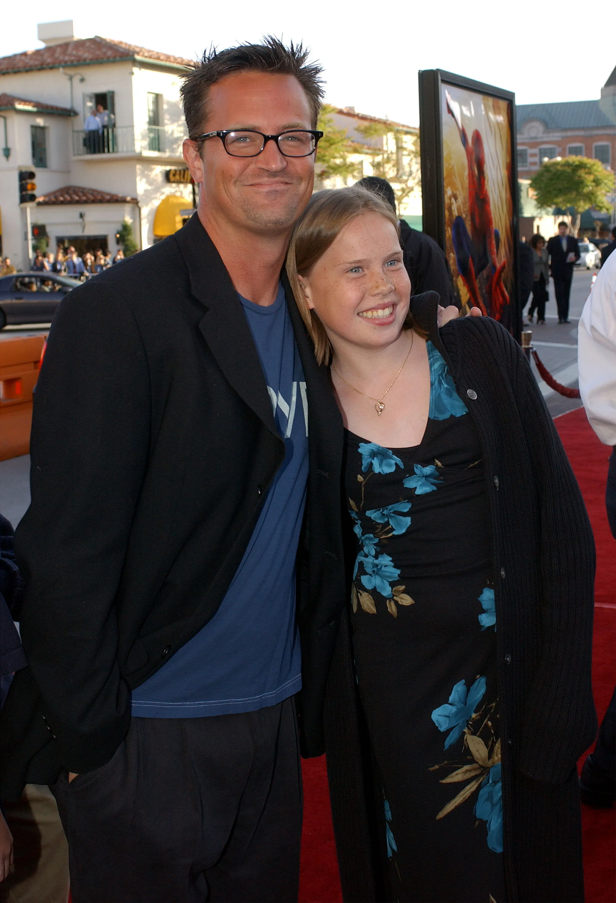 Matthew Perry and Madeline Morrison smiling at the "Spider-Man" premiere.