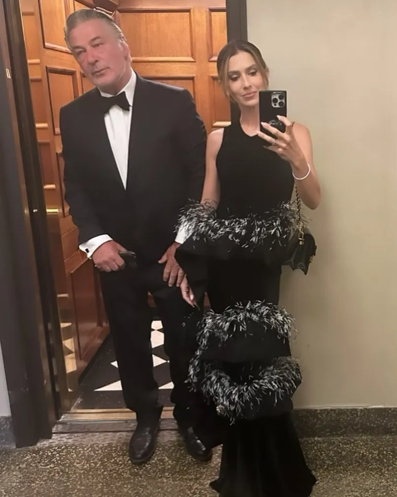 Alec and Hilaria Baldwin posing in formal wear.
