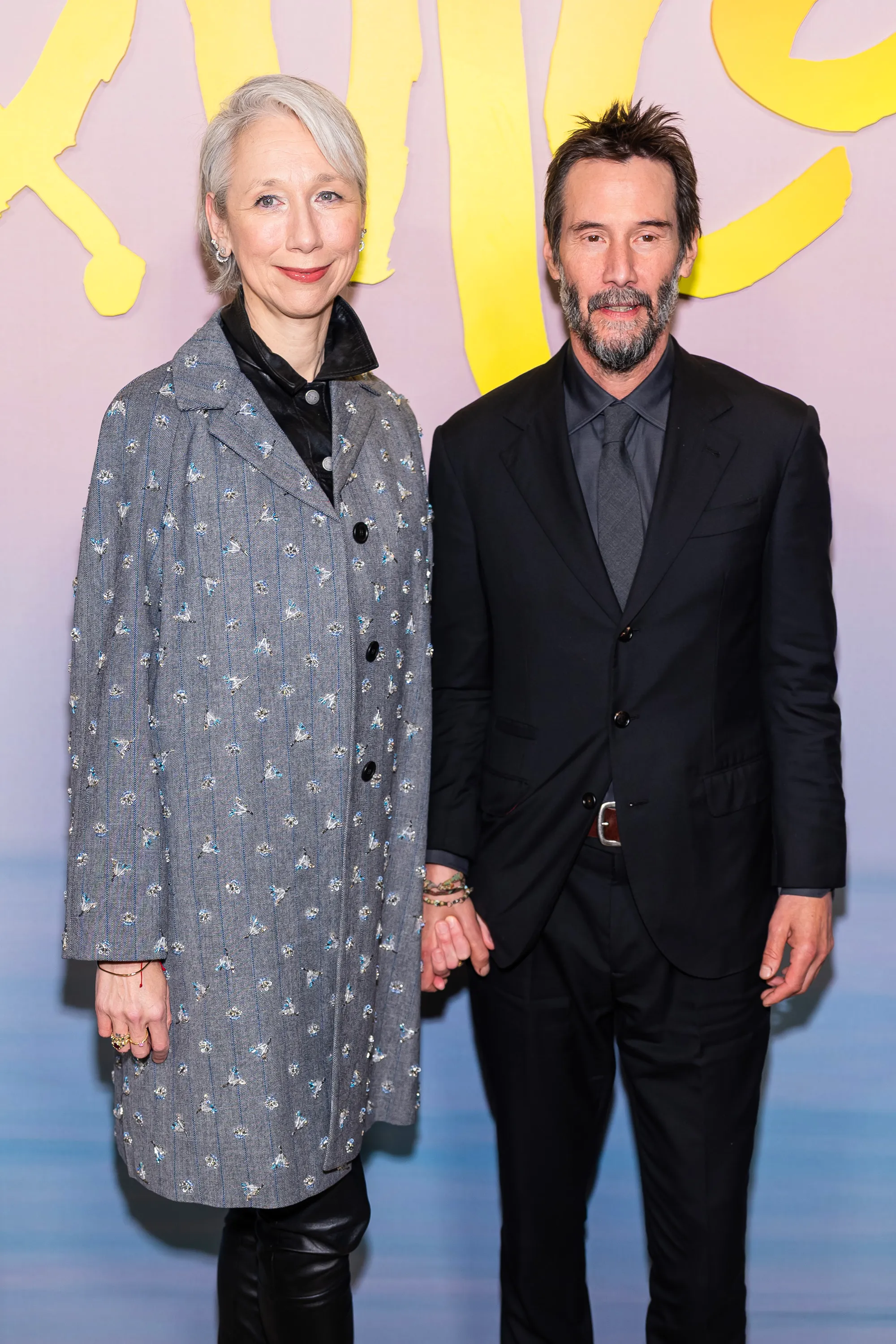 Alexandra Grant and Keanu Reeves posing together at the Apple's