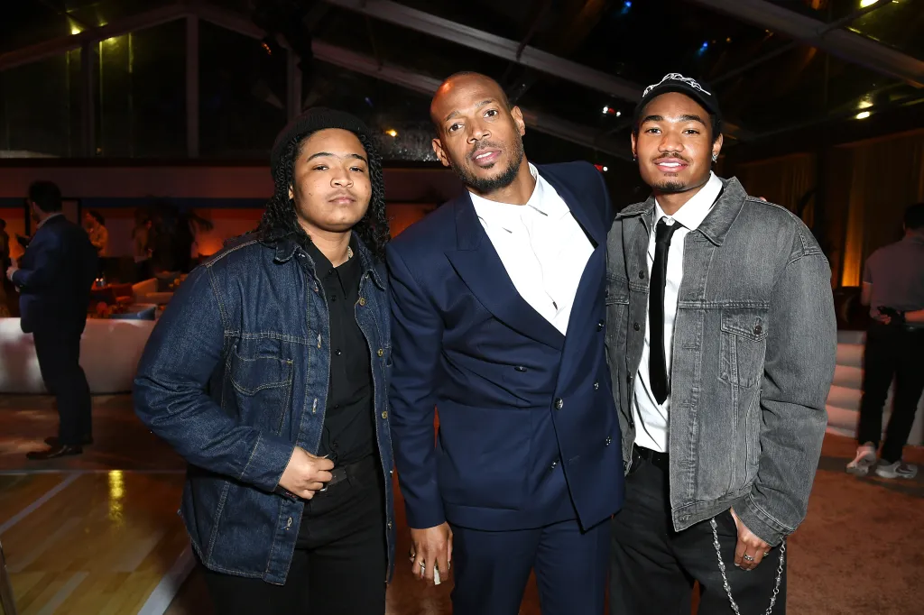 Marlon Wayans poses with his sons, Amai Zackary Wayans and Shawn Wayans, at the "AIR" film premiere after-party.