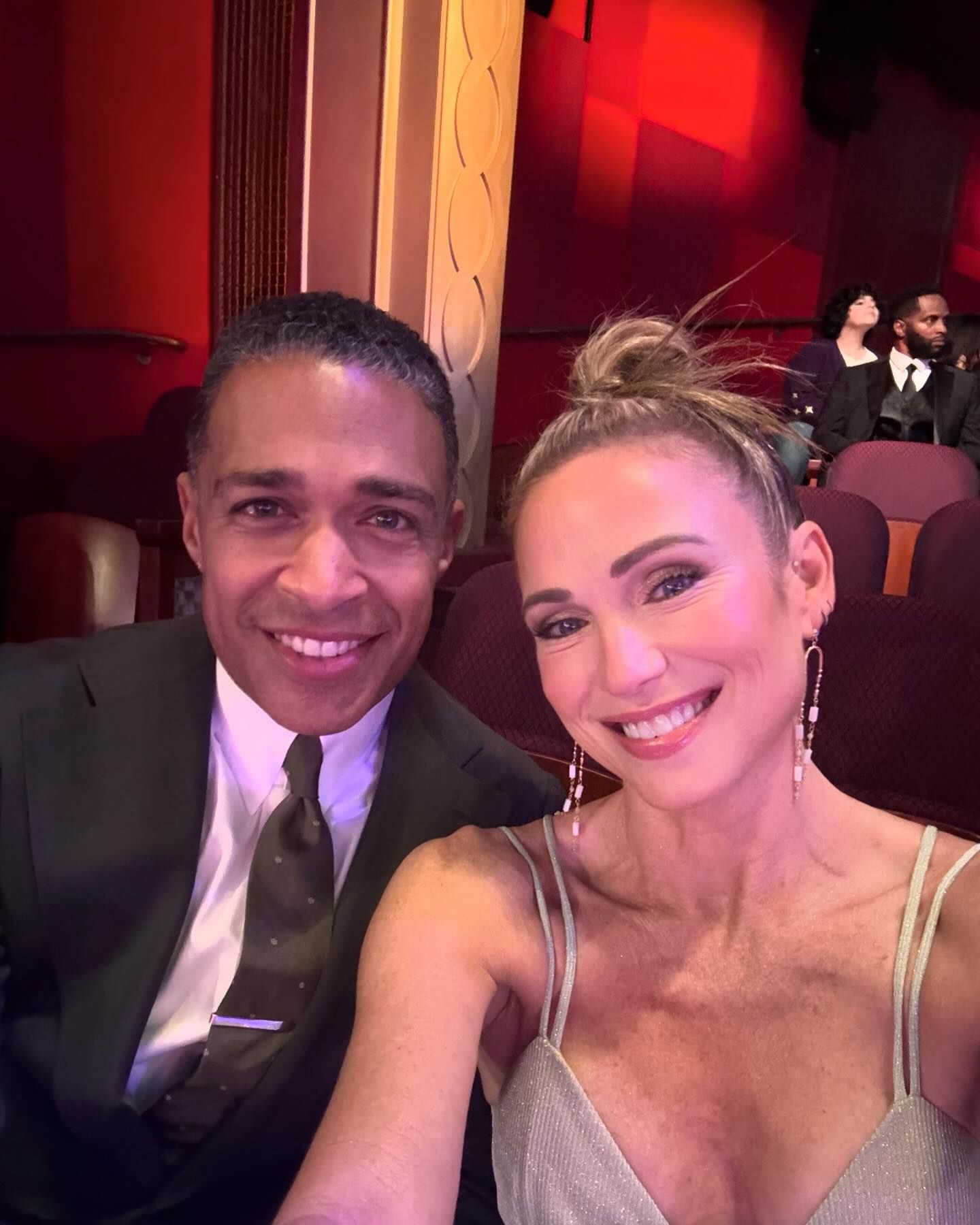 Amy Robach and TJ Holmes pose together.
